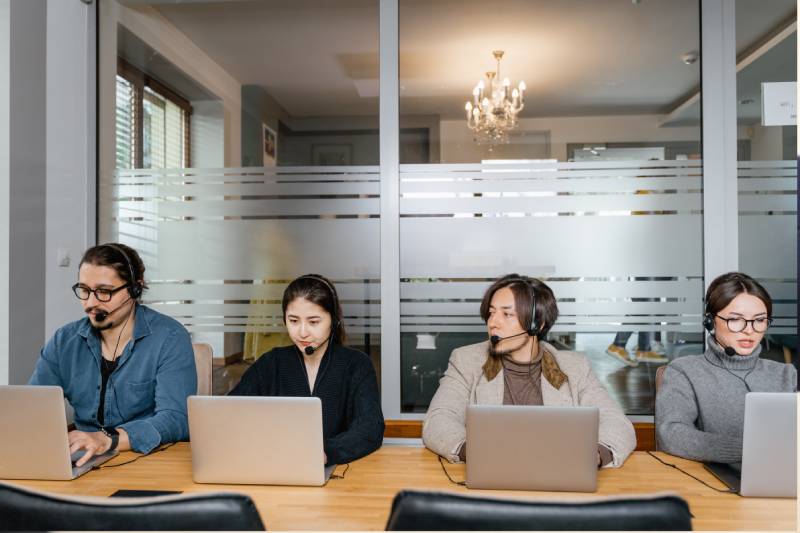 Group of young people with desktop computer